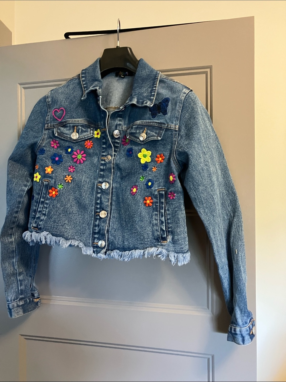 dELiA*s Blue Cropped Denim Jacket with Neon Floral Embroidery